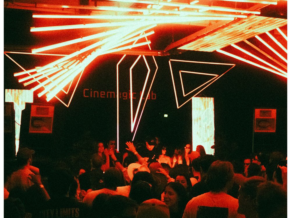Red light installation and the CINEMAGIC Lab sign over the dance floor